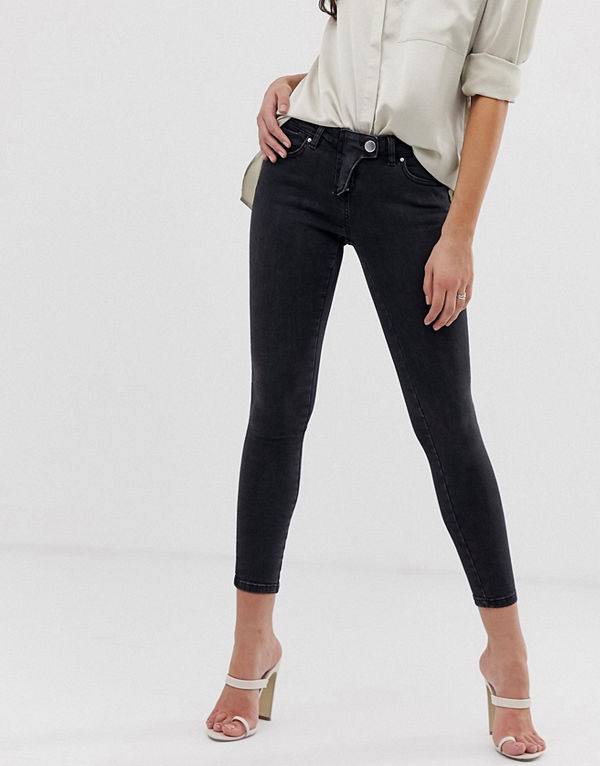 ASOS DESIGN Whitby Svarta skinny jeans med låg midja och cowboyinspirerad gylf Rensvarta