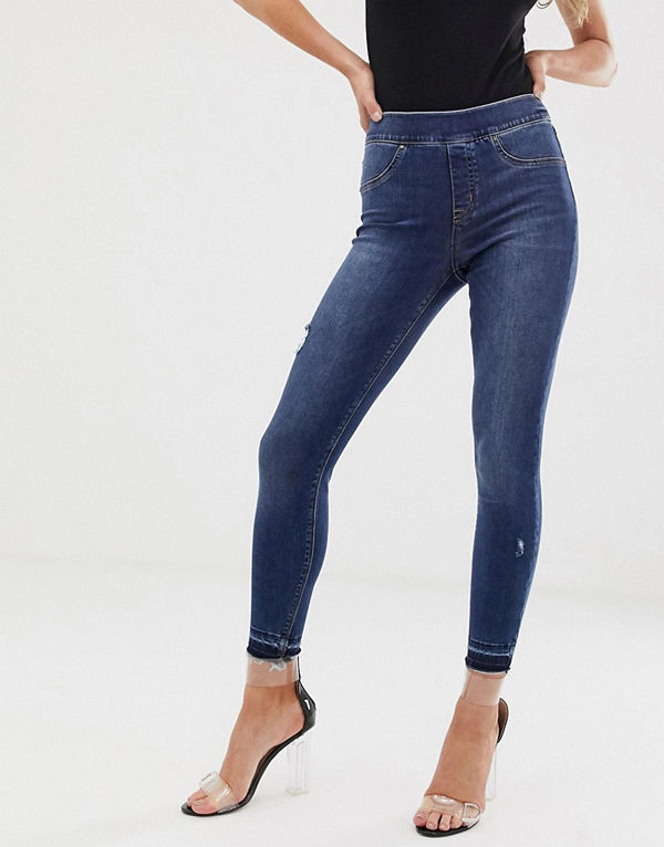 Spanx Shape and Lift Skinny jeans med slitna detaljer Mellanblå tvätt