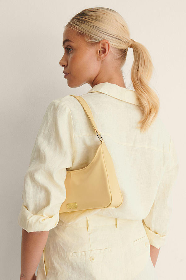 NA-KD Accessories Sportig Axelväska gul