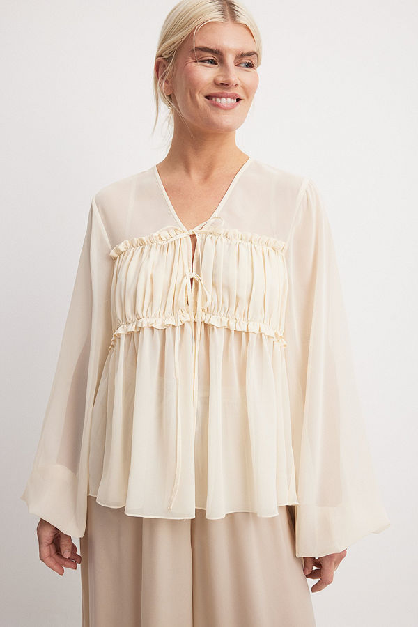 NA-KD Blus med knytdetalj och ballongärmar beige